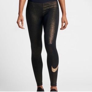 Black NIKE leggings with Gold Specks and a Gold Nike Swoosh